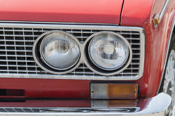Detail of a circular vintage car light.
