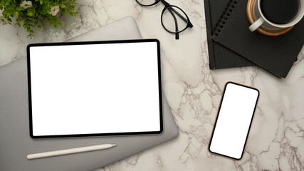 Modern office desk, top view, with digital tablet and smartphone mockup