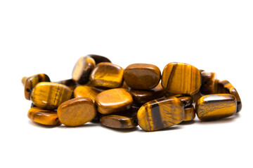 Beads and necklaces made of semi-precious stones tiger's eye. Against the background of beautiful...