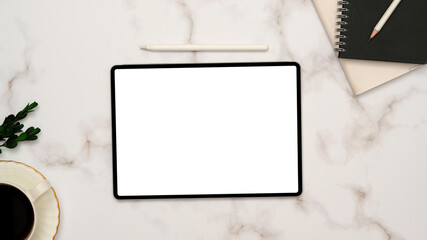 Minimal white marble office desk background with portable tablet