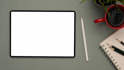 Digital tablet empty screen mockup on modern grey background.