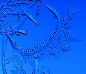 Drawings of ice on blue glass.