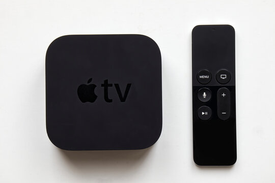 Bologna - Italy - February 28, 2022:  Apple TV and wireless remote on white background.