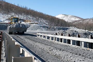Khabarovsk territory / Russia - 03.22.2018 : Special equipment works on the territory of the gold mine and delivers raw materials.