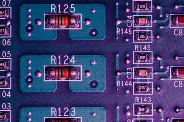 Close-up fragment of an electrical circuit desoldering on a computer motherboard