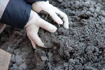 Khabarovsk territory / Russia - 03.22.2018 : Workers of a mining and metallurgical enterprise are busy unloading ore