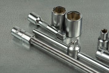Auto mechanic's tools on a gray metal table. Close-up on a gray background