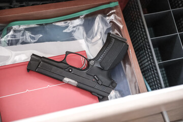 Gun in the drawer of the nightstand