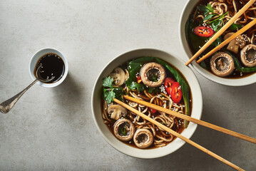 Asian soup with buckwheat noodles and mushrooms. Asian soba noodles with mushrooms menu recipe for diet or detox. - obrazy, fototapety, plakaty
