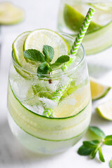 summer refreshing cocktail with lime and cucumber, selective focus, close-up