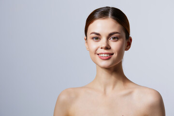 young woman smiling woman bare shoulders clean skin charm close-up Lifestyle