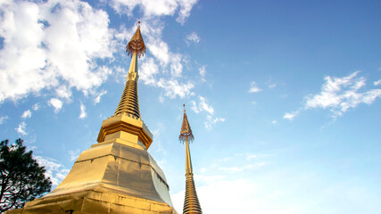 Fototapeta premium golden stupa buddhism temple on sky in Thailand