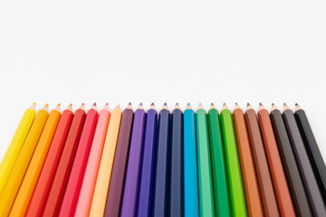 Many multicolored pencils, isolated on white background with copy space. Art and education background.
