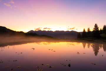 Reflected Sunrise Over Mountains