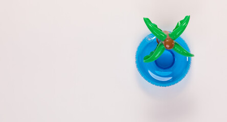 Top view closeup isolated studio shot of colorful shape swimming pool lifesaving kid rubber ring using on sea beach vacation placed on white background.