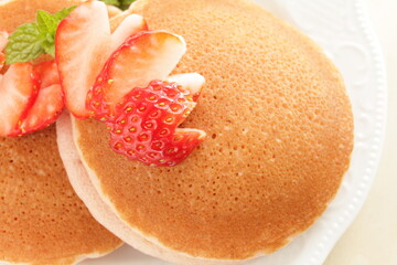 Homemade strawberries and pancake in pink color for cafe food 