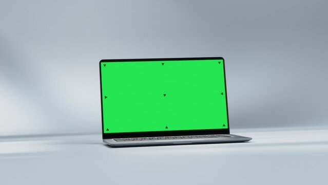 Mockup Shot of Laptop Computer with Green Screen in Bright, Cozy, Sunlit Abstract Environment. 3D Animation. Screen has Tracking Markers