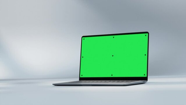 Mockup Shot of Laptop Computer with Green Screen in Bright, Cozy, Sunlit Abstract Environment. 3D Animation. Screen has Tracking Markers