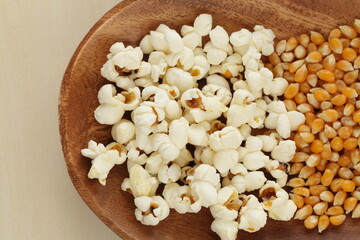 dried corn on wooden plate for cooking popcorn ingredient