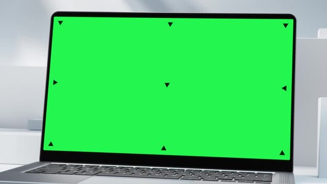 Mockup Shot of Laptop Computer with Green Screen in Bright, Cozy, Sunlit Abstract Environment With Shadows on Plaster Wall. 3D Animation. Screen has Tracking Markers
