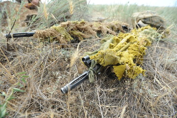 Almaty region / Kazakhstan - 06.16.2011 : Military training among snipers. Practicing the actions of soldiers in the mode of combat operations in the open field.