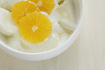 sweet mandarin orange and yogurt with copy space