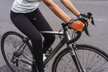 Fototapeta na wymiar close up of a road bike frame, ride by female cyclist