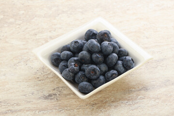 Sweet ripe blueberry heap in the bowl