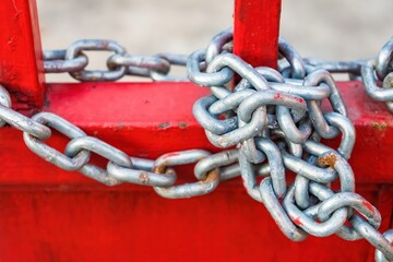 Metal gates closed on a metal chain and lock.