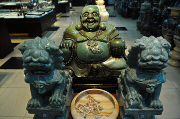 Beijing / China - 08.05.2012 : Figure of a deity in the old Chinese style. Shop for carvings made of stone, jade and glass.