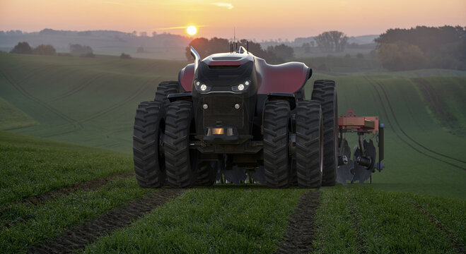 Fototapeta Autonomous farm tractor during field work