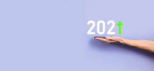 Fototapeta premium Business development to success and growing growth year 2021 concept.Plan business growth graph in year 2021 concept.Businessman plan and increase of positive indicators in his business