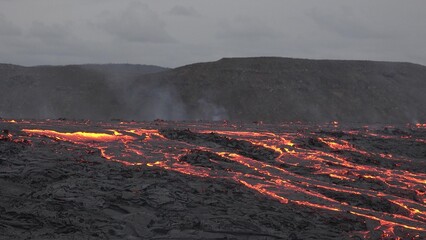 Iceland. Volcanic eruption. Flowing lava and craters.