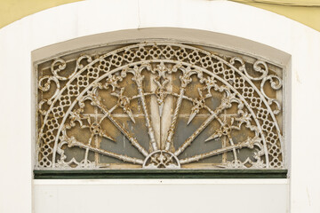 cast iron decoration above an entrance door to an old house in Portimao, Algarve, Portugal