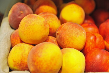 Almaty, Kazakhstan - 11.07.2012 : Sweet fruit in containers on a shelf in a large hypermarket