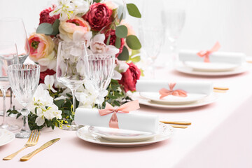 Stylish table setting with wedding invitations