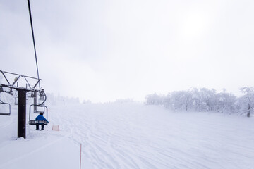 Fototapeta na wymiar A slope on a cloudy day (Zao-onsen ski resort, Yamagata, Japan)