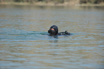 Almaty / Kazakhstan - 04.19.2012 : A soldier in a diving suit performs a task at a military...