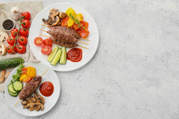 Plates of skewers with tasty lula kebab and vegetables on light background