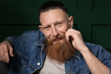 Fototapeta premium Portrait of handsome bearded man on dark background
