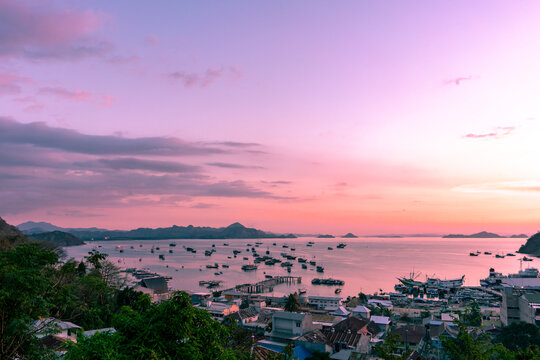 Sunset on Labuan Bajo harbor with purplish sky on East Nusa Tenggara, Indonesia