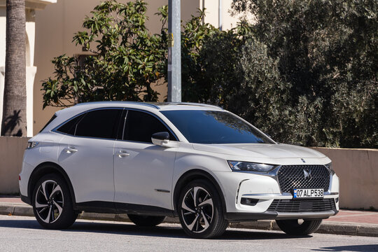 Side, Turkey – February 13 2022:   white  Citroen  DS 7 Crossback  is parked  on the street on a warm summer day against the  park