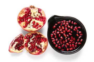 Bowl of pomegranate molasses and fresh fruits on white background