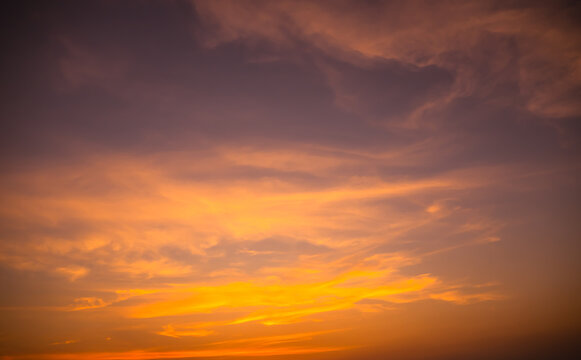 Evening Sky, twilight dramatic gold sunset dusk background. colorful sunlight cloud sky pastel bright yellow orange backdrop. nature landscape beautiful.