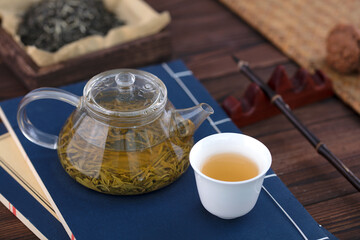 Green tea made in a glass teapot