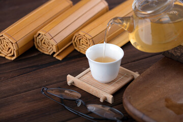 A cup of green tea and traditional Chinese slips