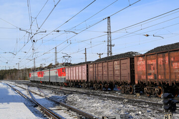 Fototapeta na wymiar The train is carrying coal. Coal wagons. Energy crisis concept.