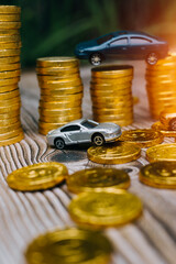 car with calculator and money on wood table. auto loan concept.