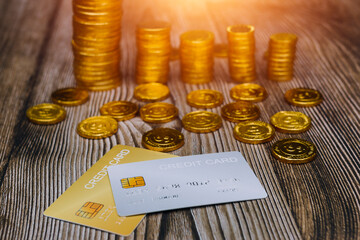 The person holds a gold credit card and is filling out their credit card information to pay for goods online, credit cards can pay for goods and services both in the storefront and online shopping.