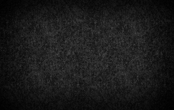 Dark gray color background textured with vignette. 